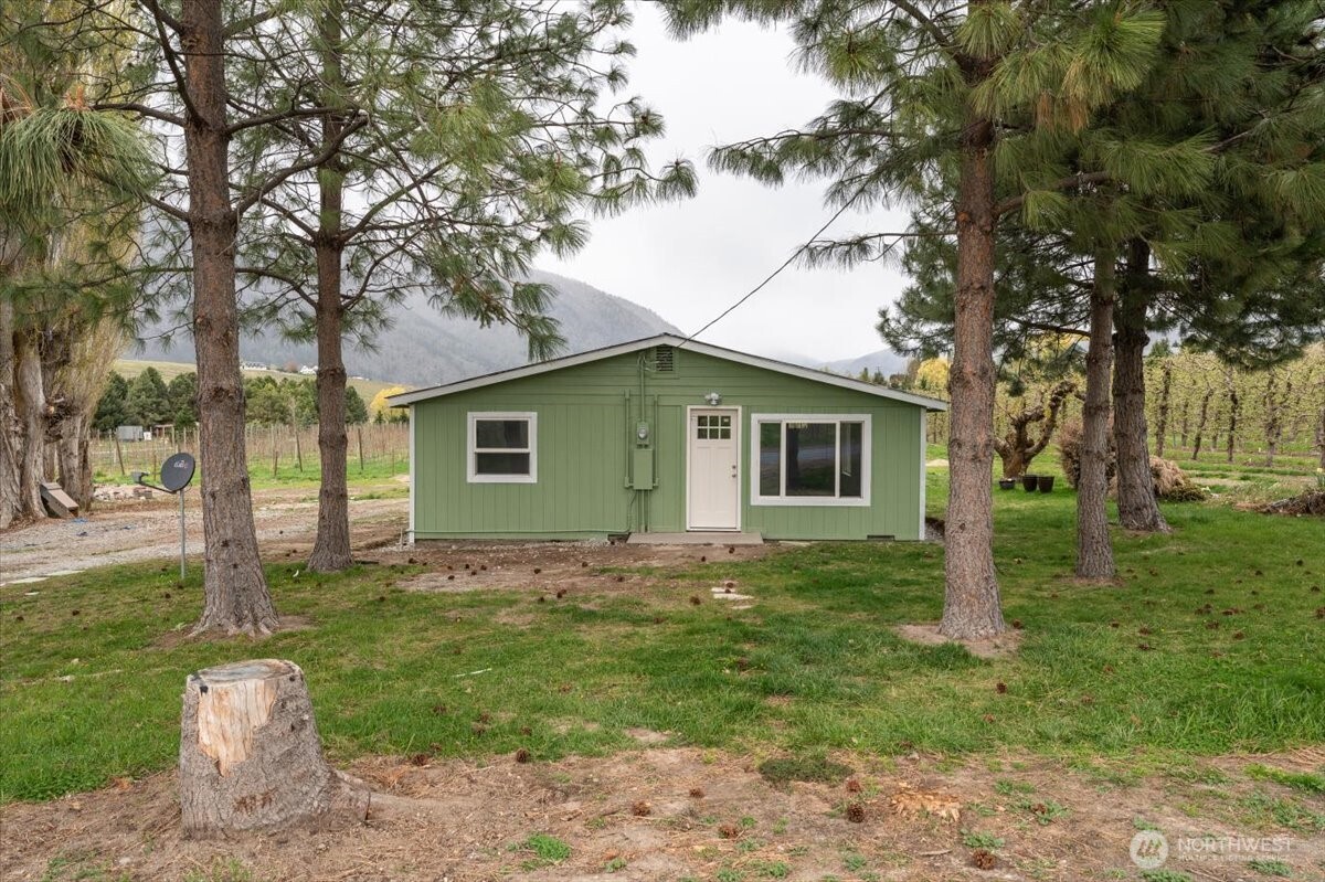 293 Barkley Road Manson, WA 98831 - Photo 26 of 40 a view of a house with a yard