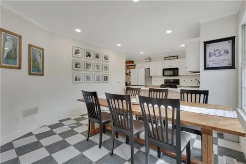 a kitchen with a stove sink and cabinets
