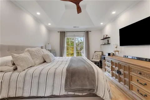 a bathroom with a granite countertop sink a large mirror and a bathtub