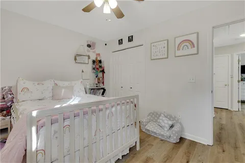 a bed room with a bed and a window