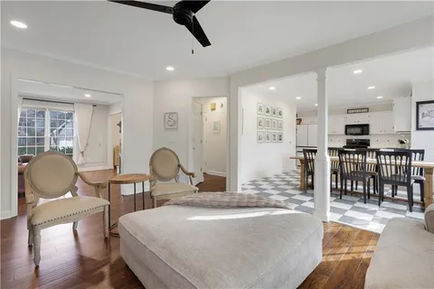 a view of a dining room with furniture and wooden floor