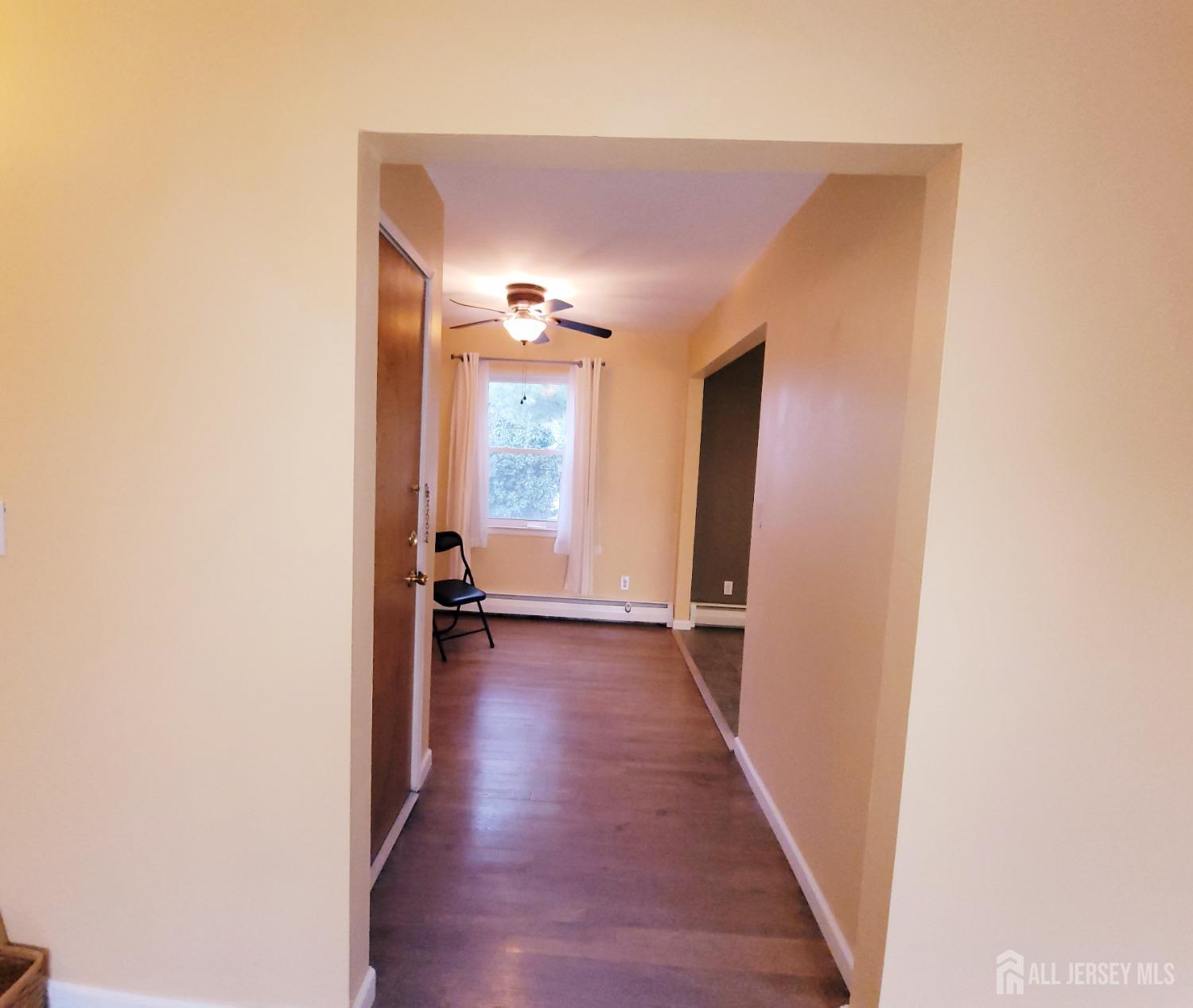 50 Fox Road, Unit 8B Edison, NJ 08817 - Photo 13 of 35 a view of a hallway with wooden floor