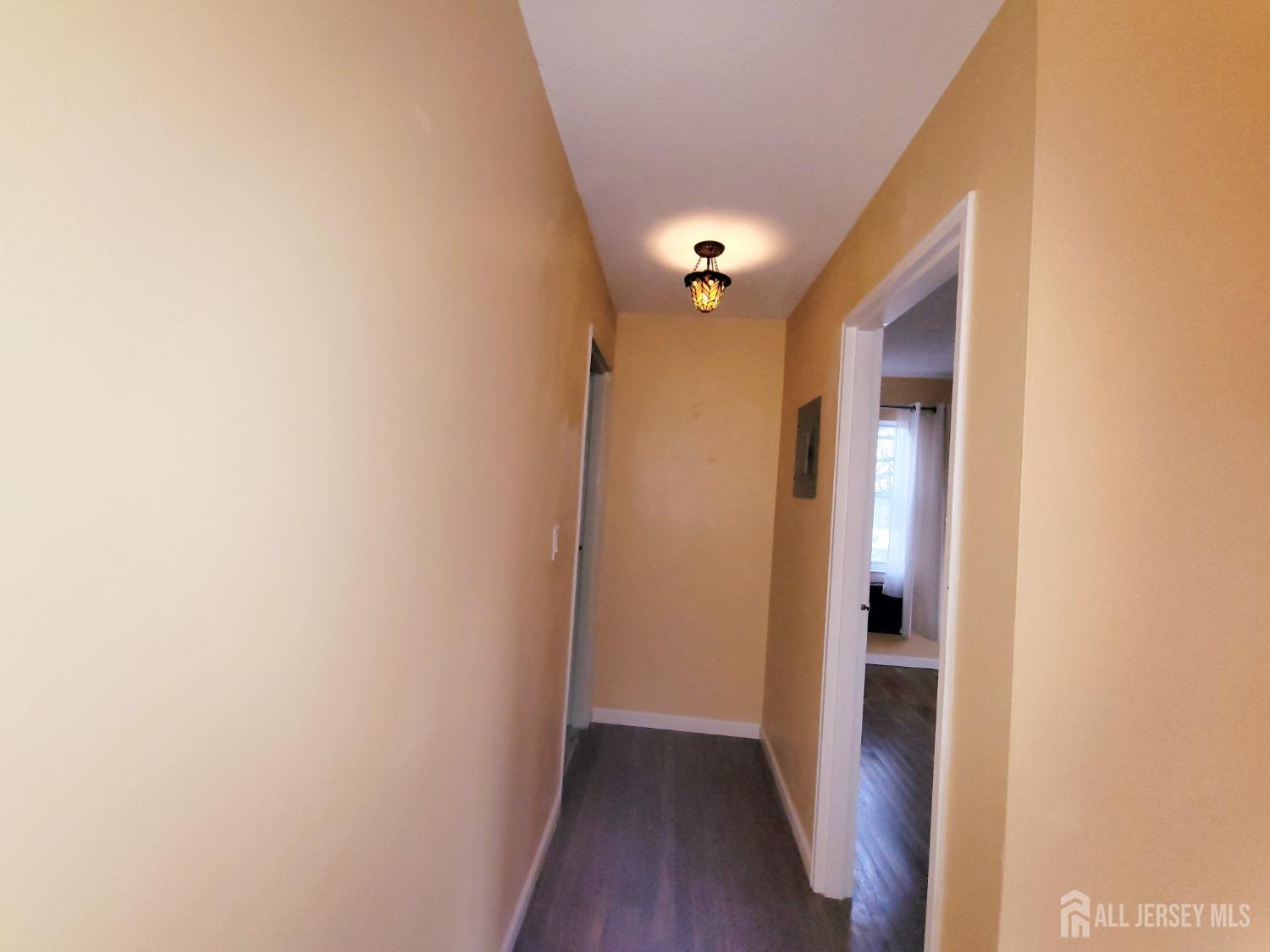 50 Fox Road, Unit 8B Edison, NJ 08817 - Photo 19 of 35 a view of a hallway with wooden floor
