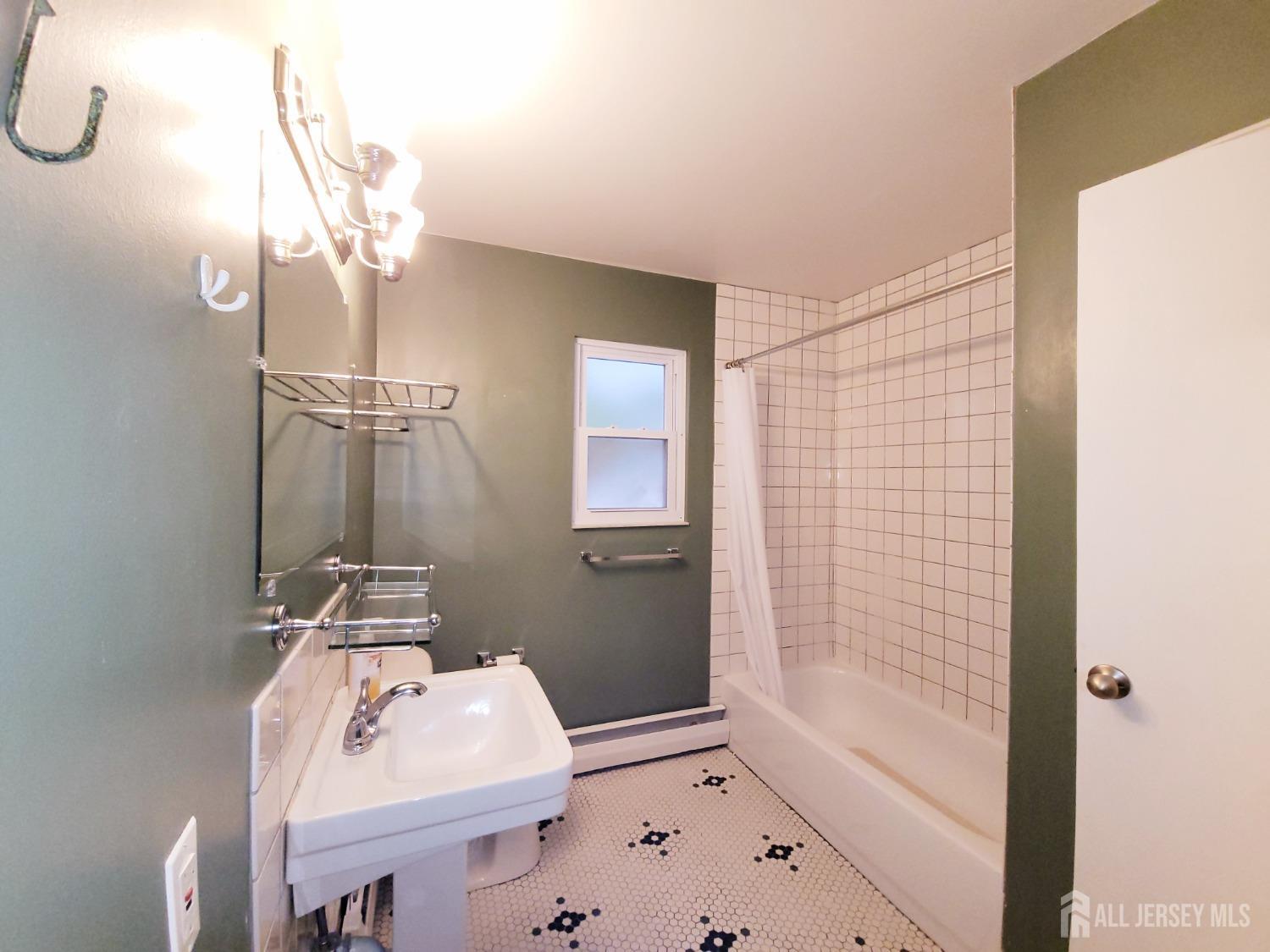 50 Fox Road, Unit 8B Edison, NJ 08817 - Photo 26 of 35 a bathroom with a sink a toilet and shower