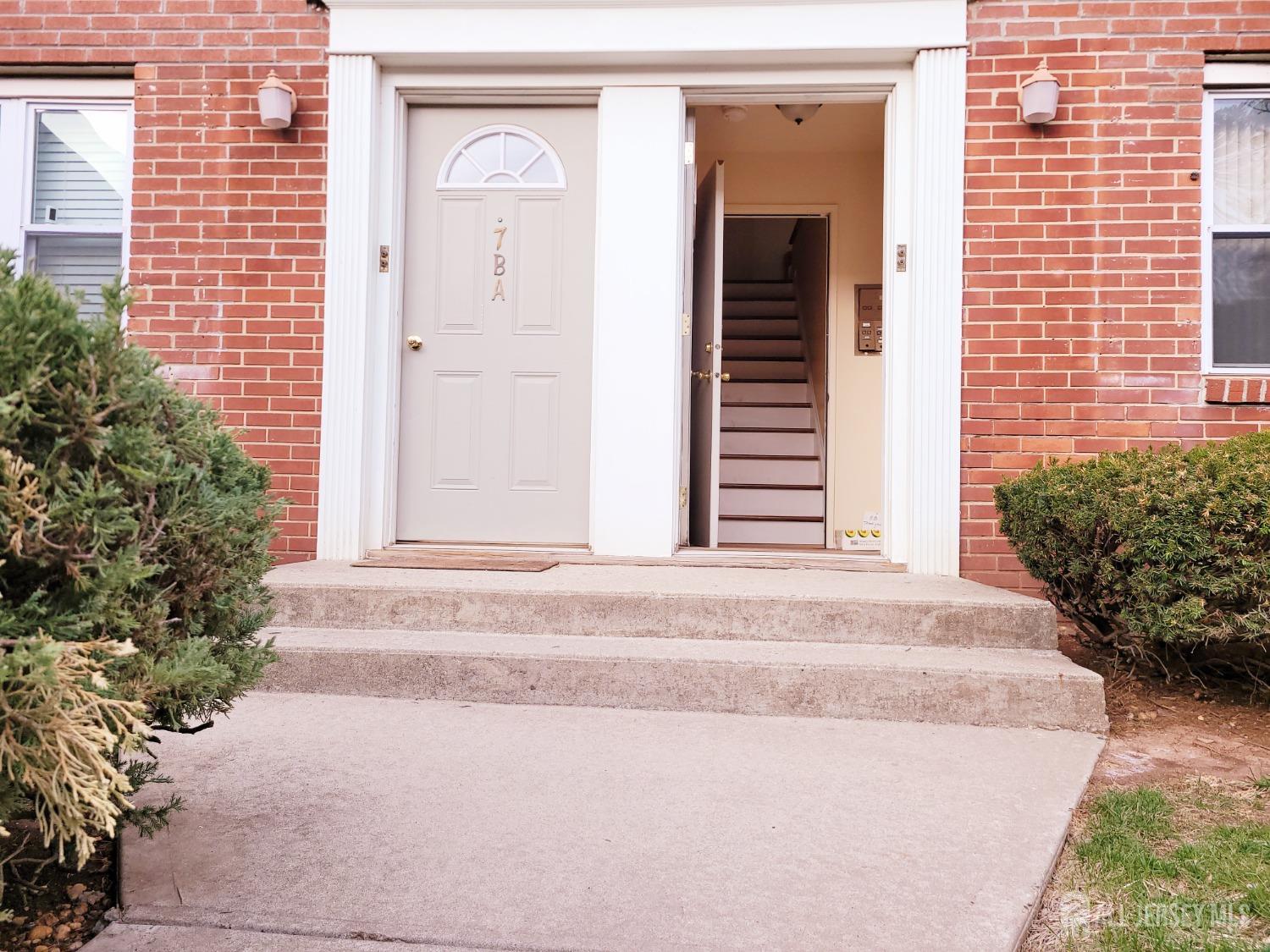 50 Fox Road, Unit 8B Edison, NJ 08817 - Photo 4 of 35 a white house with a outdoor space