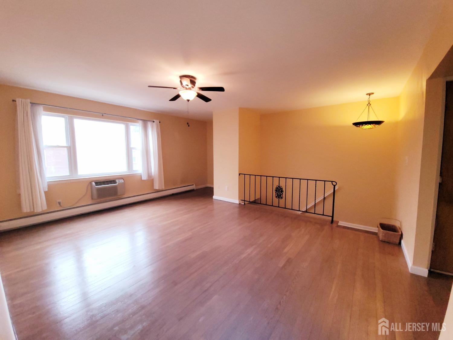 50 Fox Road, Unit 8B Edison, NJ 08817 - Photo 9 of 35 a view of a room with wooden floor and fan