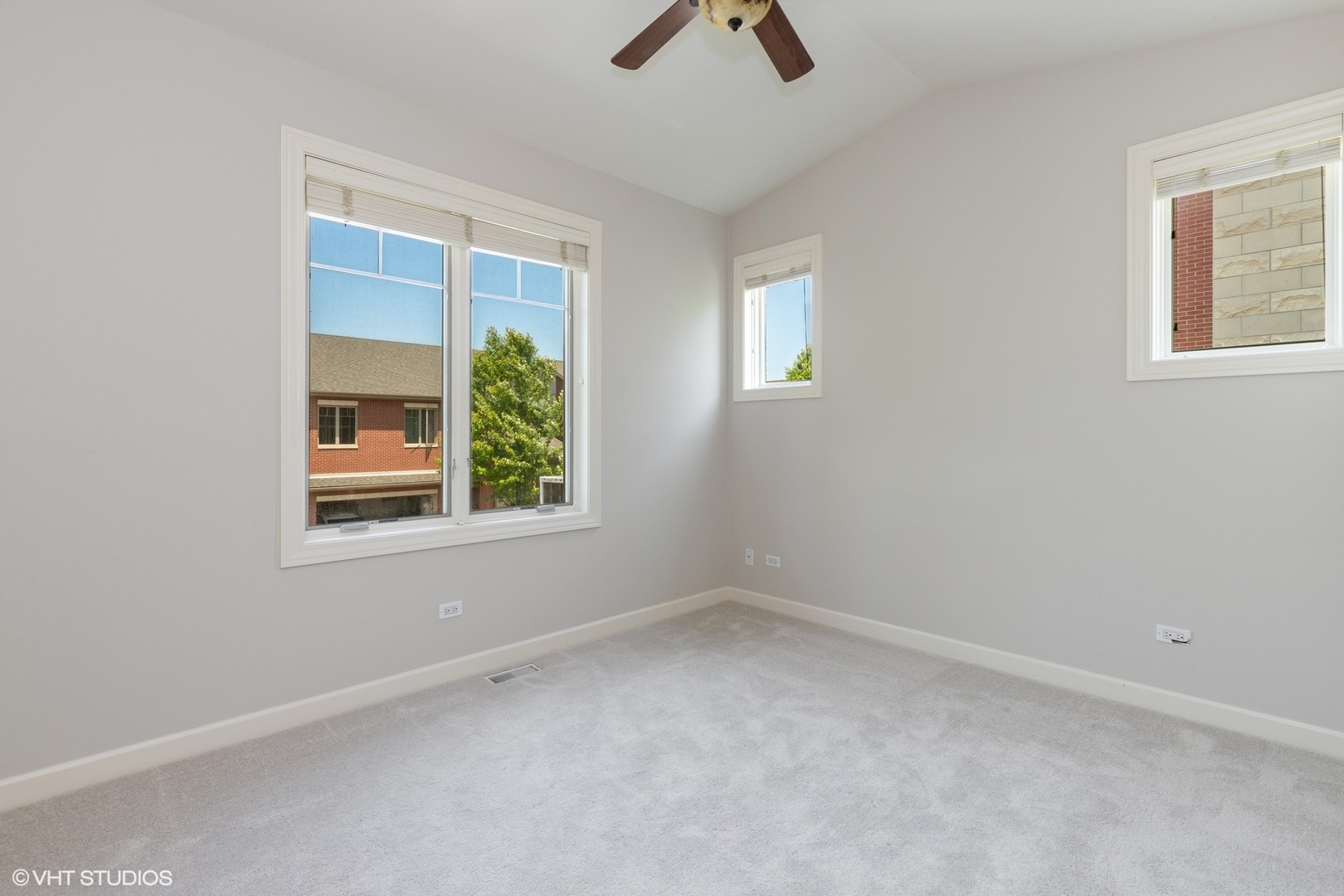 21 Northfield Terrace, Unit 21 Wheeling, IL 60090 - Photo 12 of 18 an empty room with windows