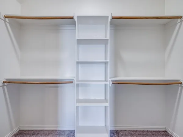a view of an empty walk in closet
