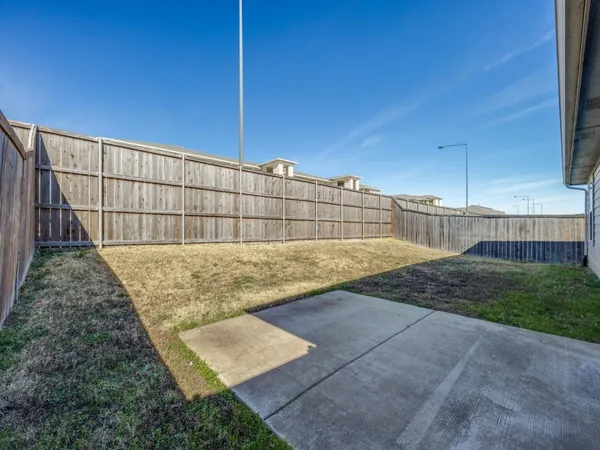 a view of outdoor space with a backyard