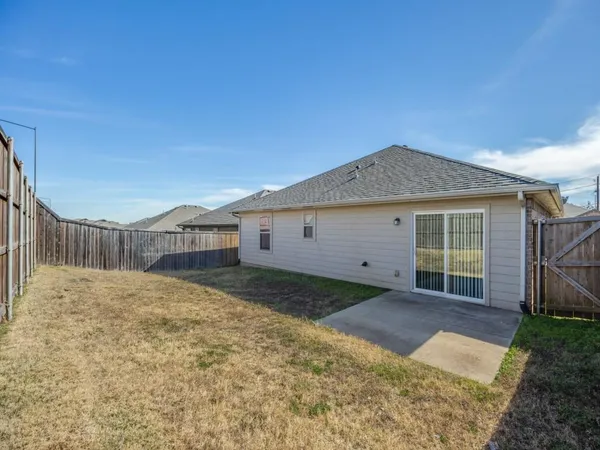 a house view with a backyard space