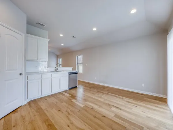 a view of kitchen with wooden floor