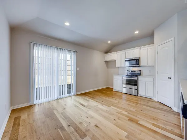 a view of kitchen with wooden floor