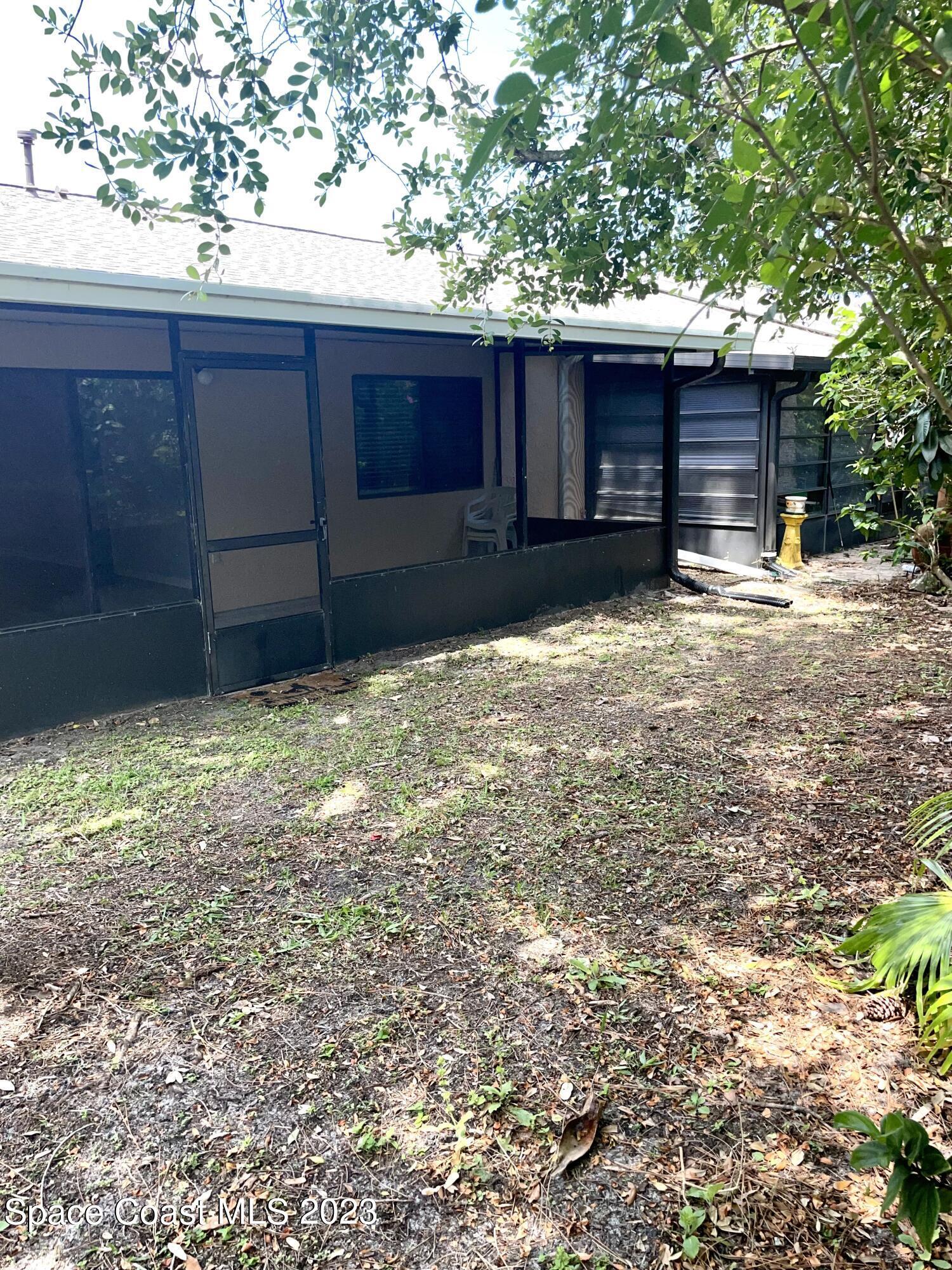 179 Shell Place, Unit 36 Rockledge, FL 32955 - Photo 16 of 20 a house with a yard