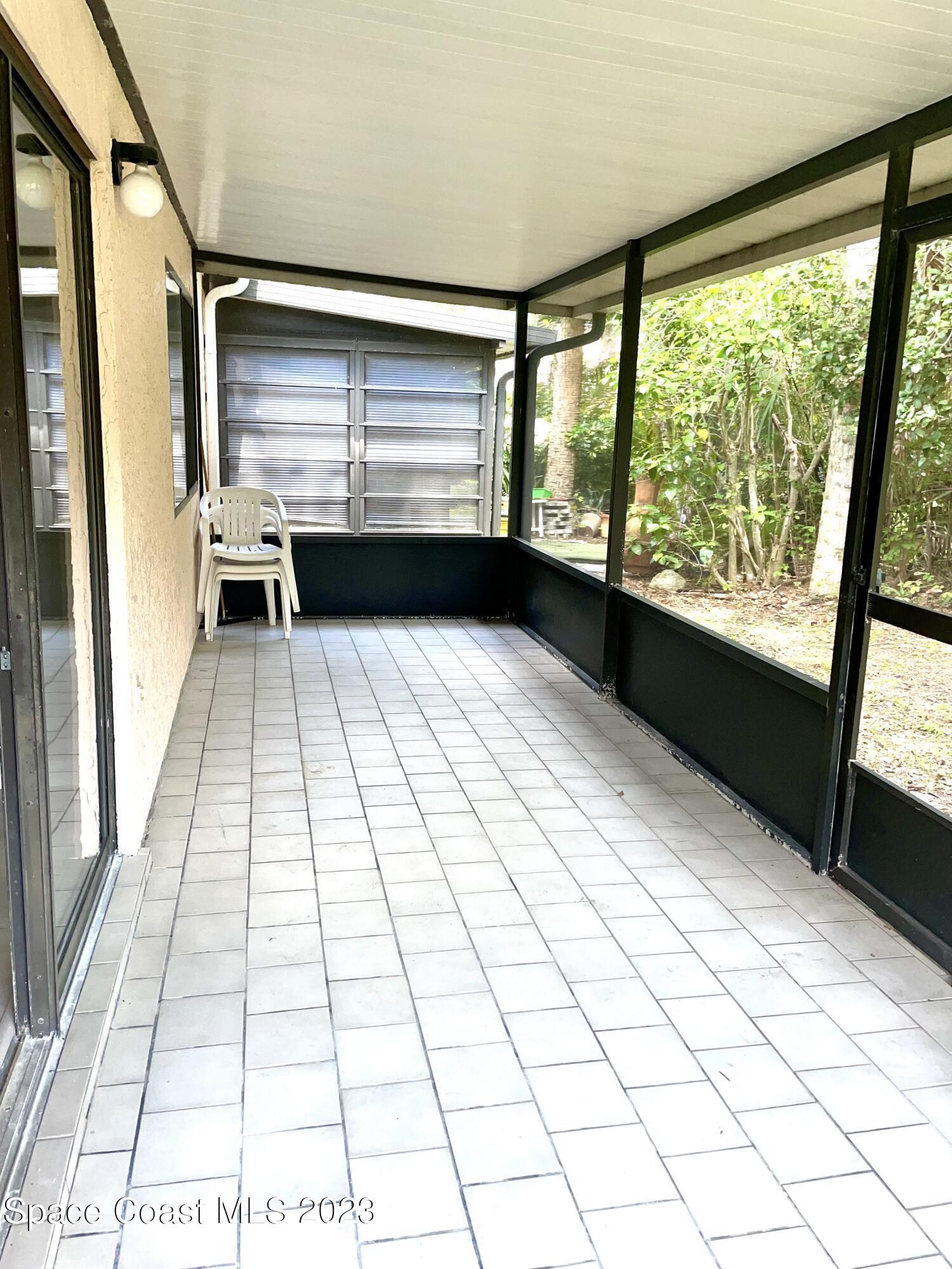 179 Shell Place, Unit 36 Rockledge, FL 32955 - Photo 3 of 20 a view of an empty room and window