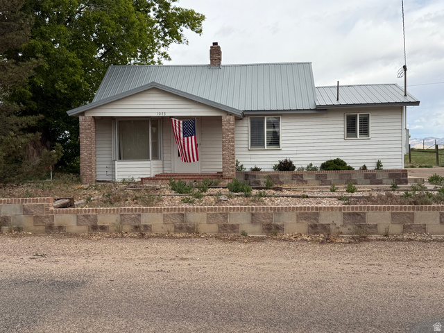1043 East 4000th Street South Vernal, UT 84078 - Photo 1 of 31 Single-story residence featuring white siding and a light grey metal roof