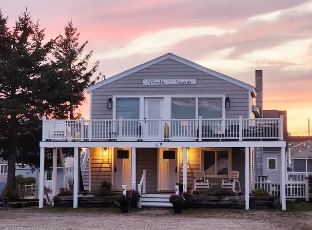 a front view of a building with parking space