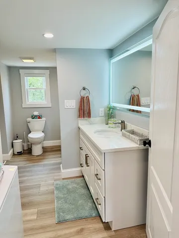 a front view of a building with a garden