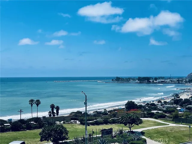a view of a lake with houses in the back