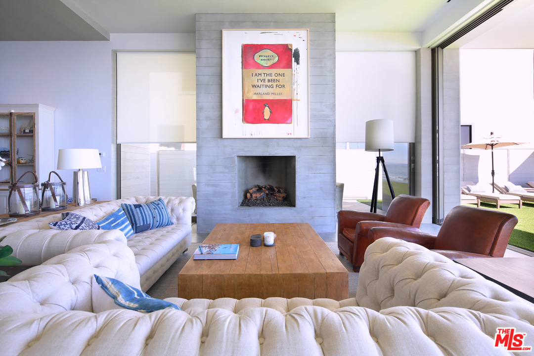 23956 Malibu Road Malibu, CA 90265 - Photo 5 of 26 a living room with furniture and a fireplace