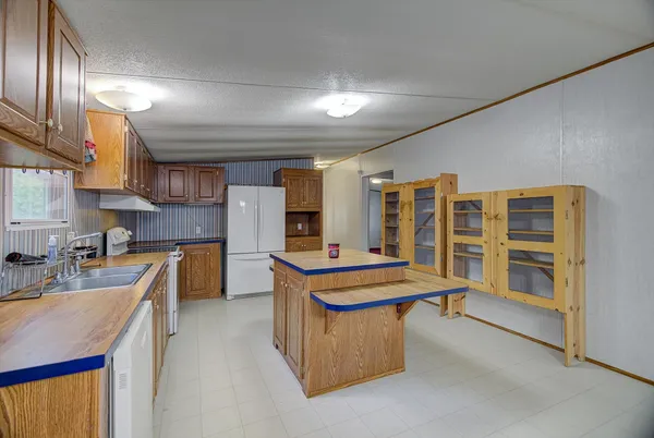 a kitchen with table and chairs