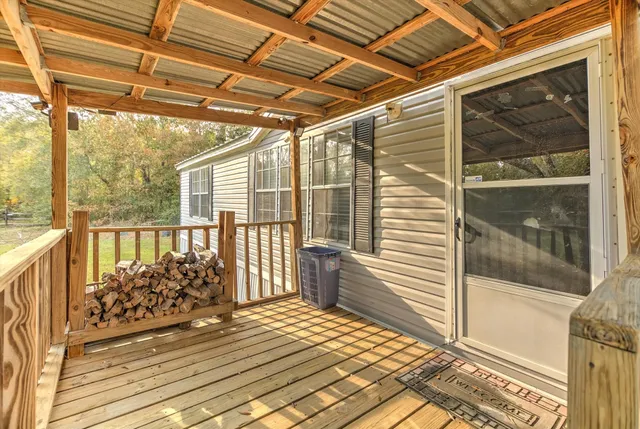 a view of a balcony with wooden floor
