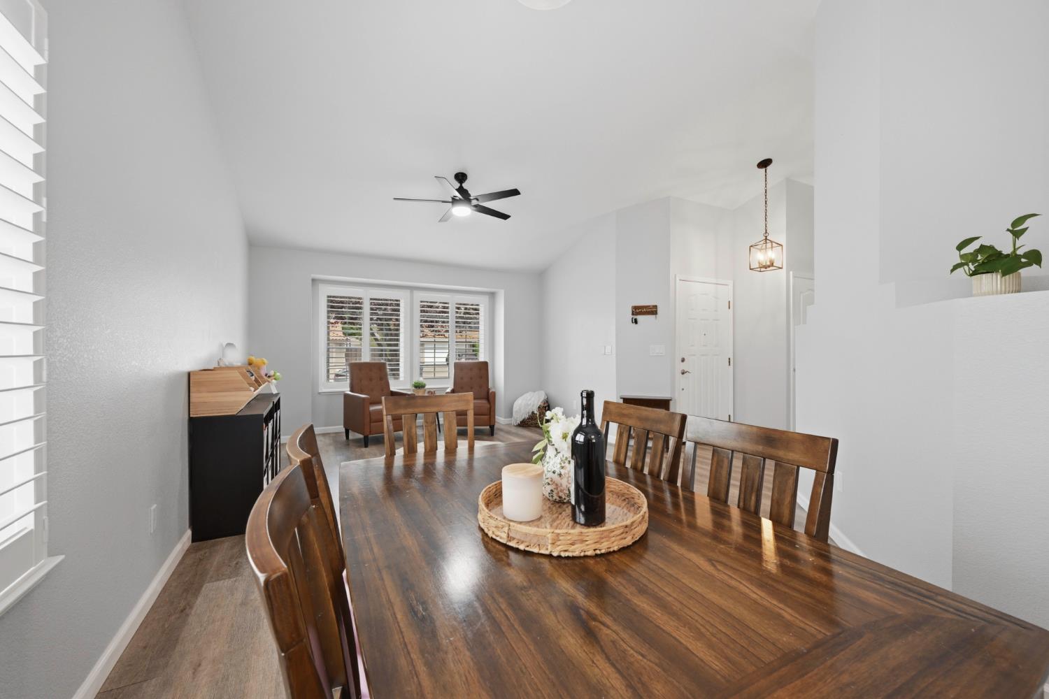 5013 Charter Road Rocklin, CA 95765 - Photo 8 of 35 a view of a dining room with furniture and wooden floor