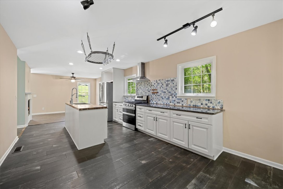 210 Briarcliff Road Central, SC 29630 - Photo 13 of 39 This bright kitchen features a functional island and abundant natural light.