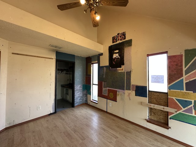 548 Spring River Drive Martindale, TX 78655 - Photo 12 of 17 Unfurnished bedroom featuring wood finished floors and a ceiling fan