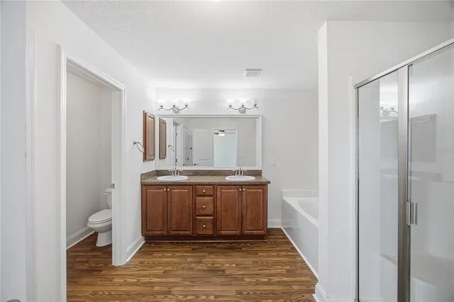 a bathroom with a sink a mirror and a shower