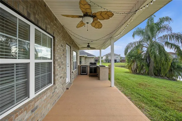 a kitchen with stainless steel appliances granite countertop a stove and a refrigerator