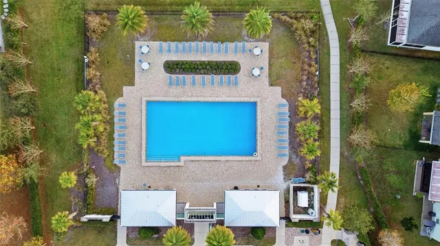 an aerial view of residential house with outdoor space and swimming pool