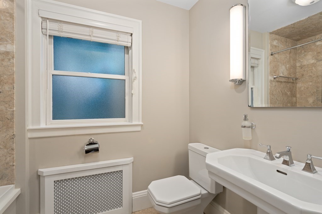 7 Stanley Road Newton, MA 02468 - Photo 13 of 18 a bathroom with a sink and a mirror