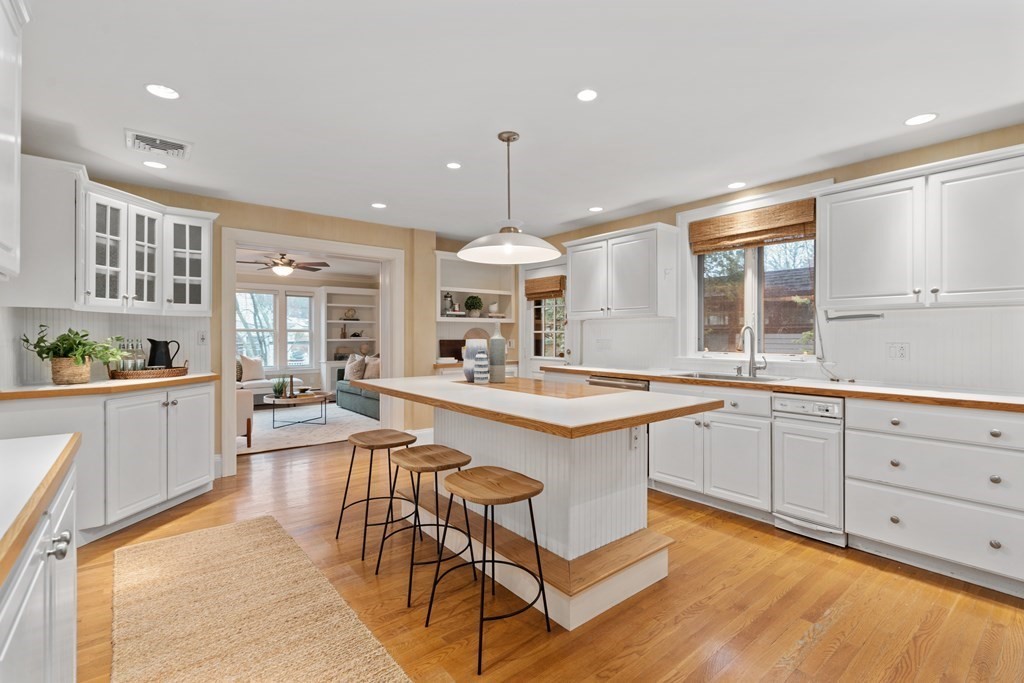 7 Stanley Road Newton, MA 02468 - Photo 8 of 18 a large kitchen with granite countertop lots of counter space and windows