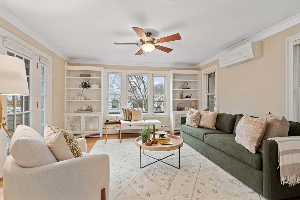 7 Stanley Road Newton, MA 02468 - Photo 9 of 18 a living room with furniture and a large window