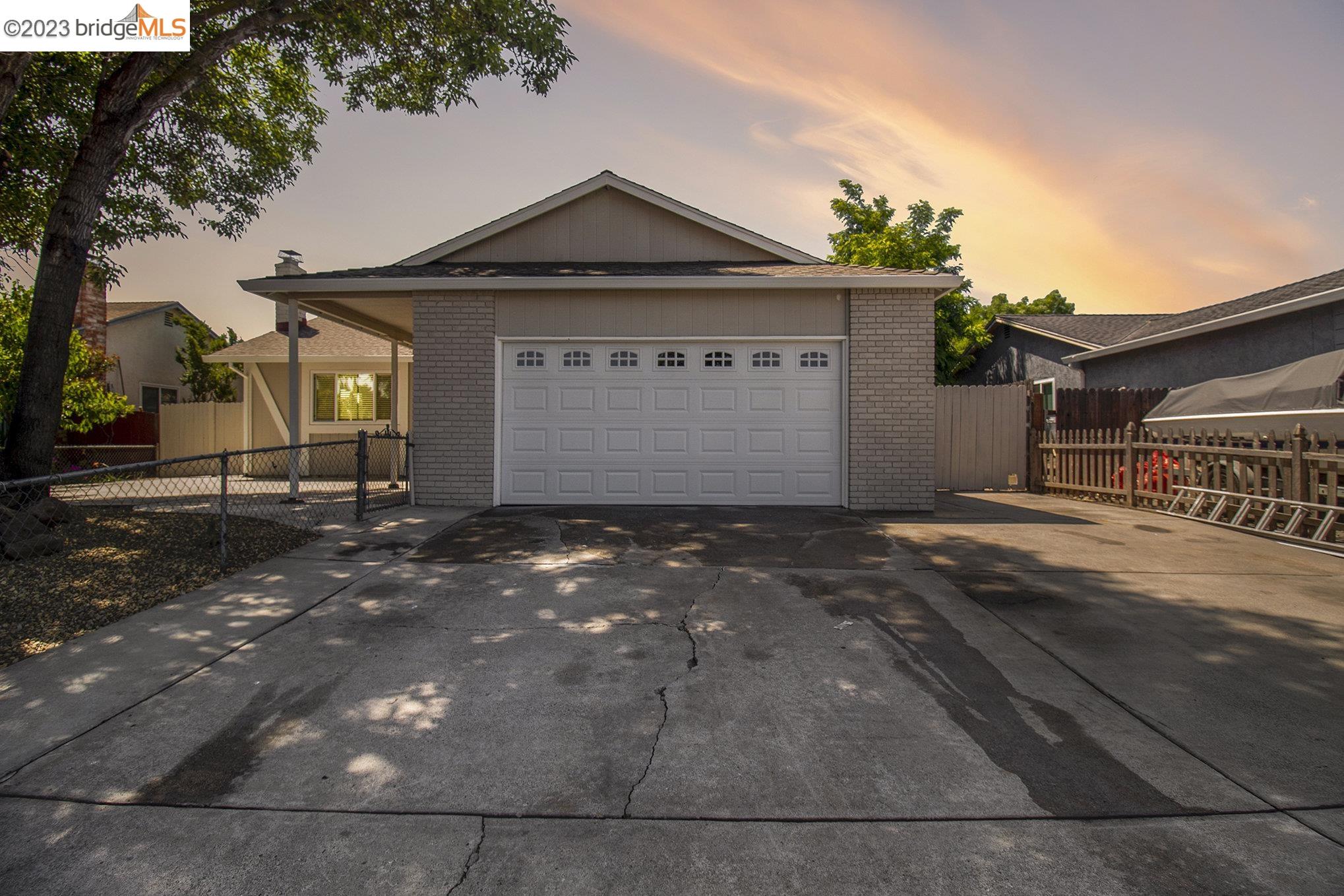 Oakley Oakley, CA 94561 - Photo 1 of 1 a front view of a house with a yard and garage