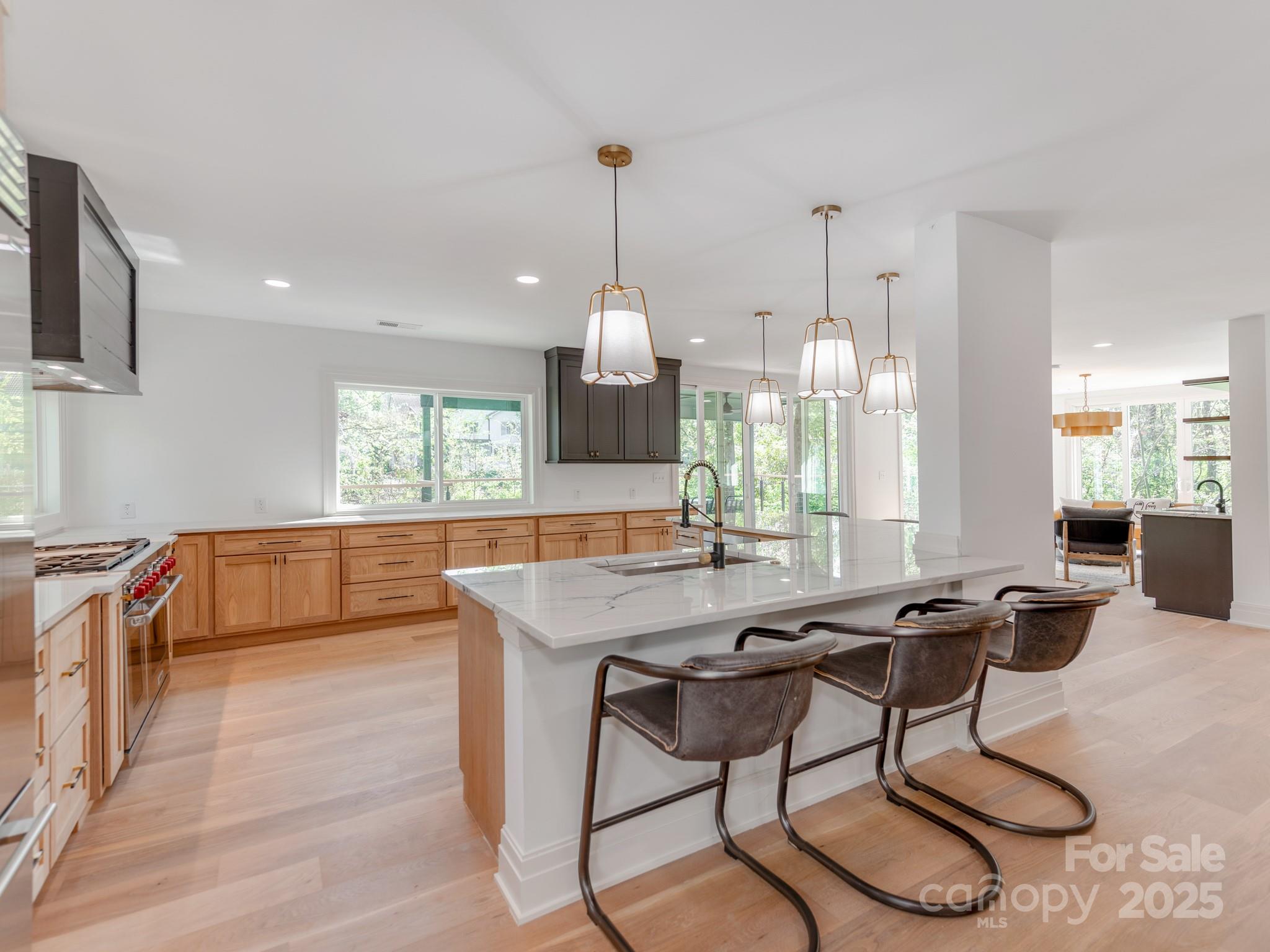1417 South Wendover Road Charlotte, NC 28211 - Photo 12 of 44 a dining hall with stainless steel appliances granite countertop a stove a sink a oven with a dining table and chairs