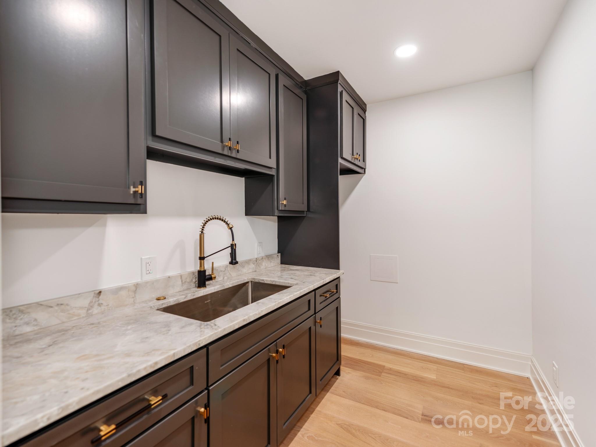 1417 South Wendover Road Charlotte, NC 28211 - Photo 14 of 44 a kitchen with stainless steel appliances granite countertop a sink and a stove