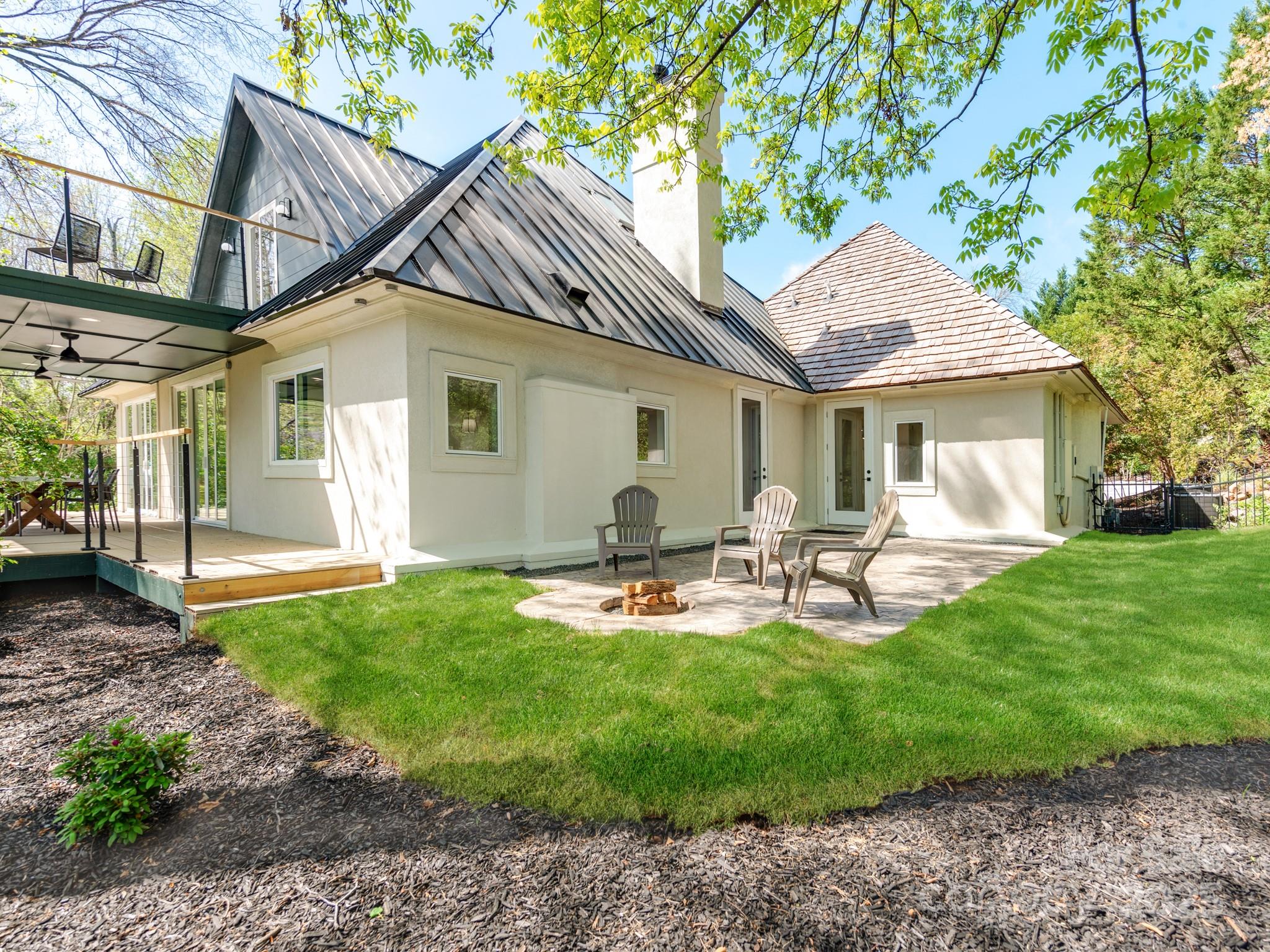 1417 South Wendover Road Charlotte, NC 28211 - Photo 17 of 44 a front view of a house with backyard and sitting area