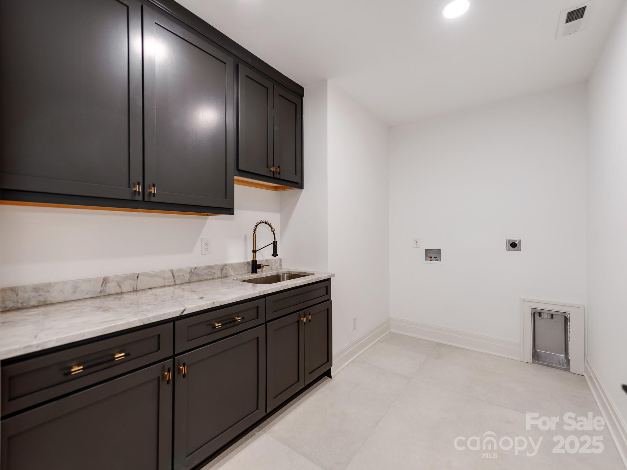1417 South Wendover Road Charlotte, NC 28211 - Photo 19 of 44 a kitchen with a sink and cabinets