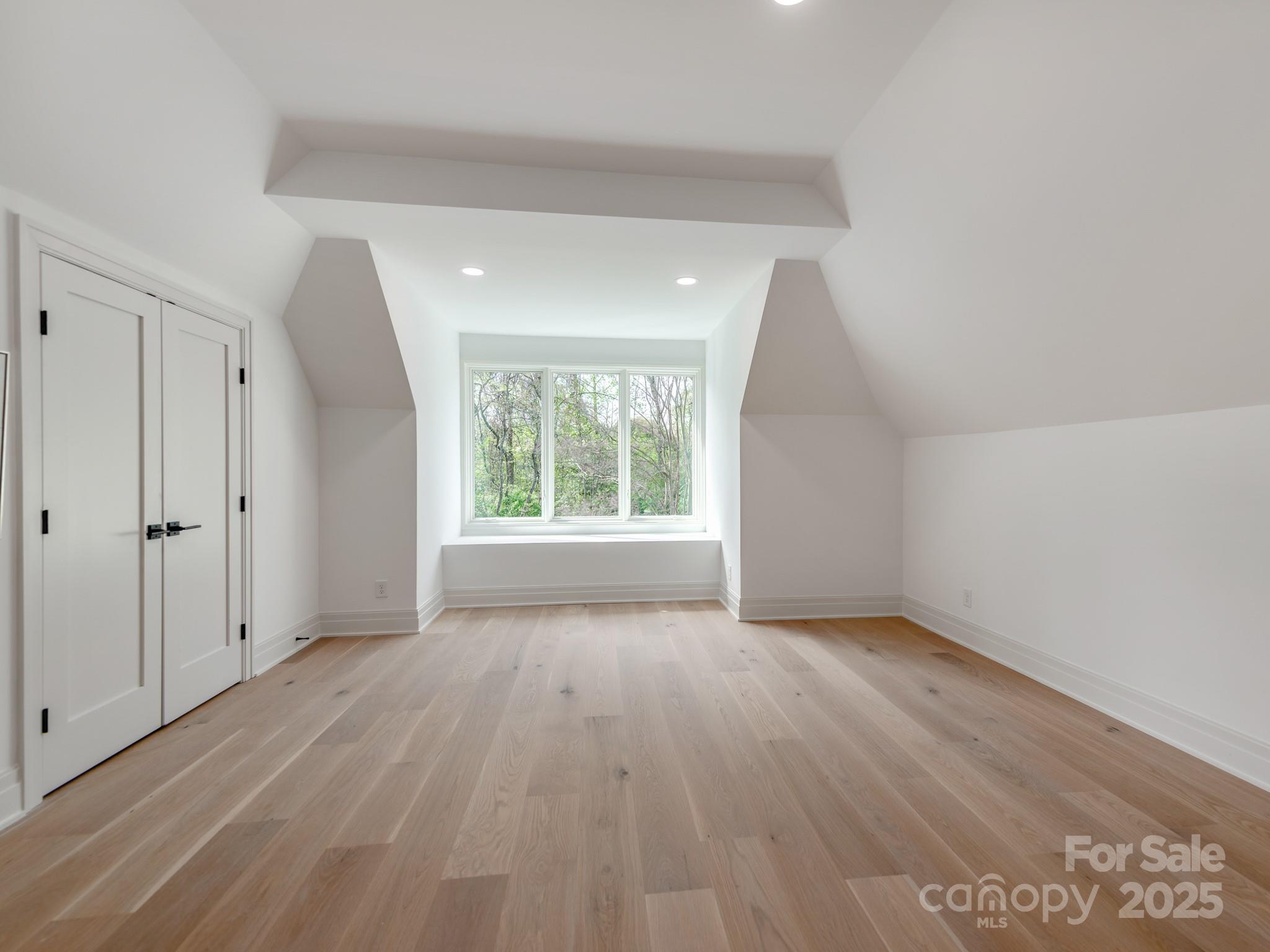 1417 South Wendover Road Charlotte, NC 28211 - Photo 34 of 44 wooden floor in an empty room with a window