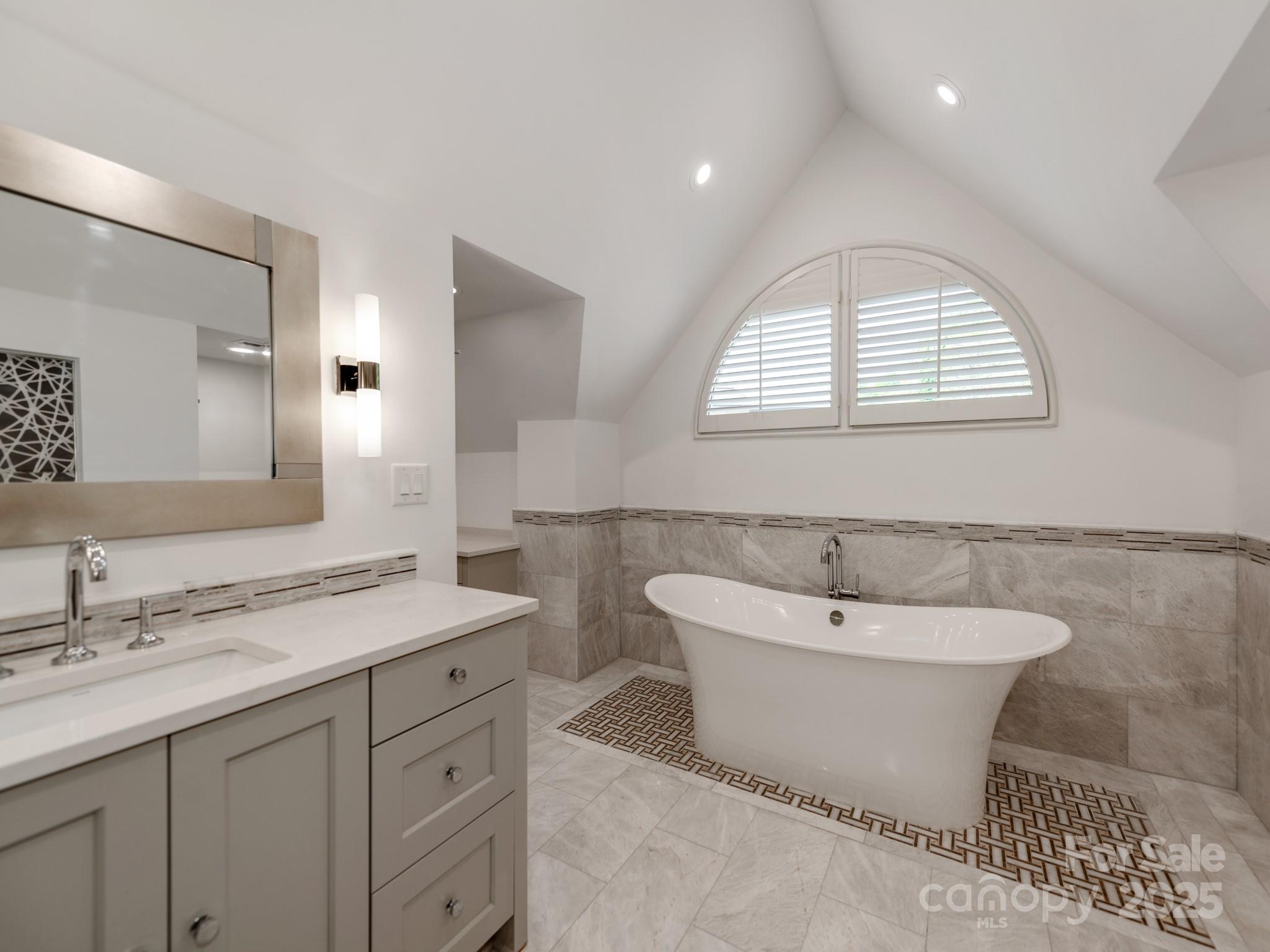 1417 South Wendover Road Charlotte, NC 28211 - Photo 37 of 44 a bath room with a sink and a mirror