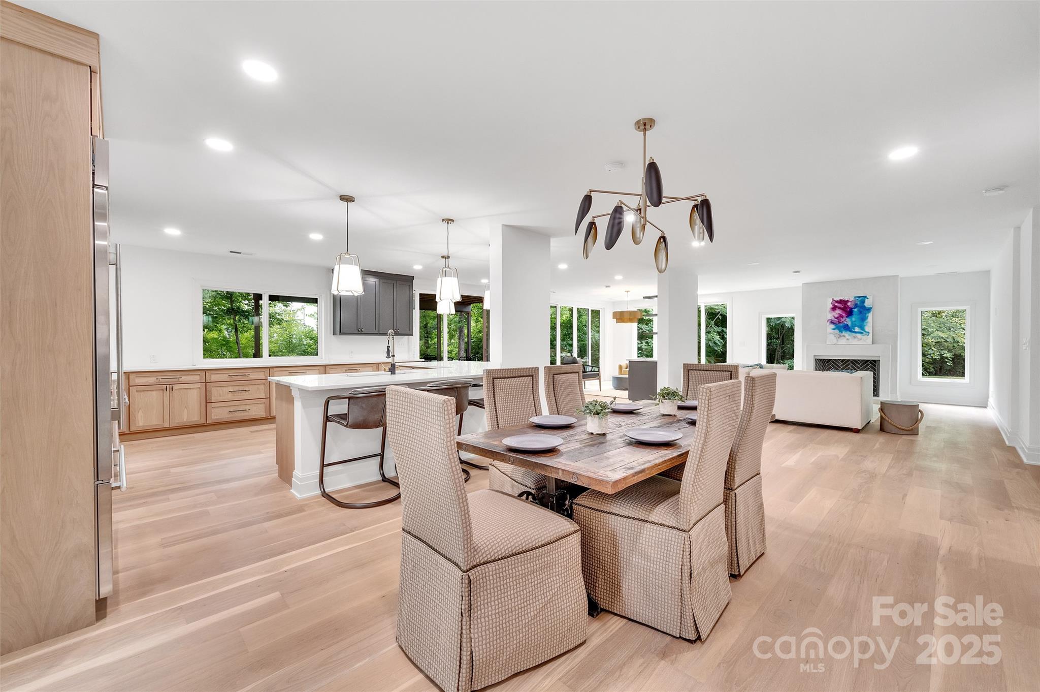 1417 South Wendover Road Charlotte, NC 28211 - Photo 4 of 44 a dining room with furniture a chandelier and wooden floor