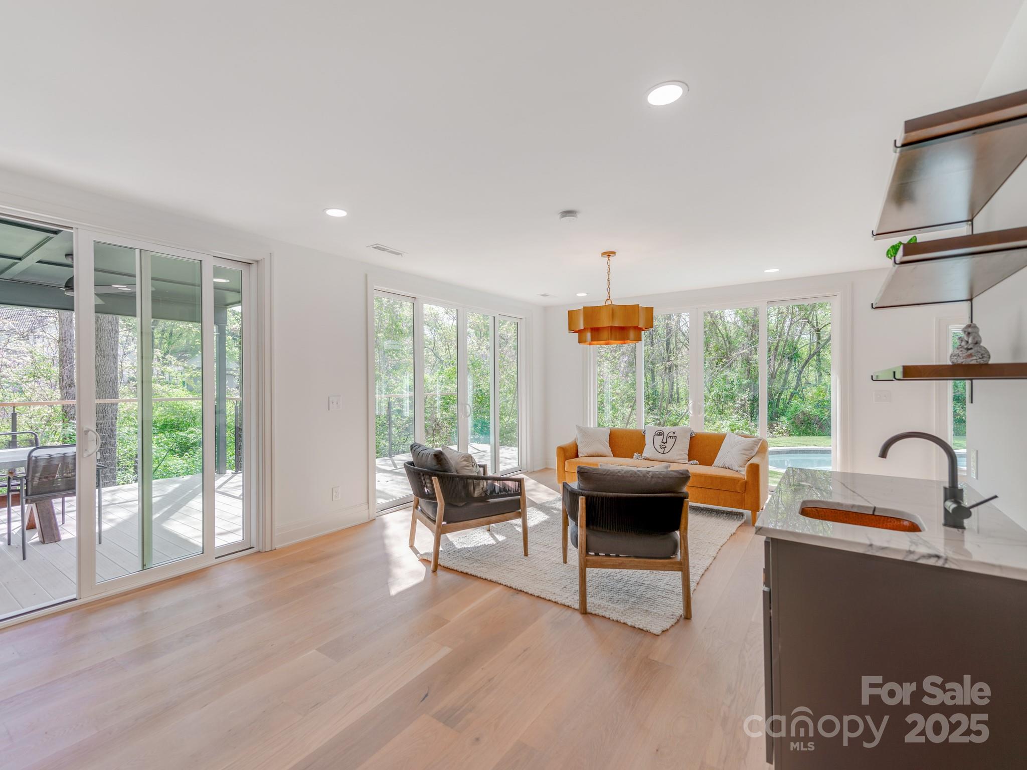 1417 South Wendover Road Charlotte, NC 28211 - Photo 7 of 44 a living room with furniture and large windows
