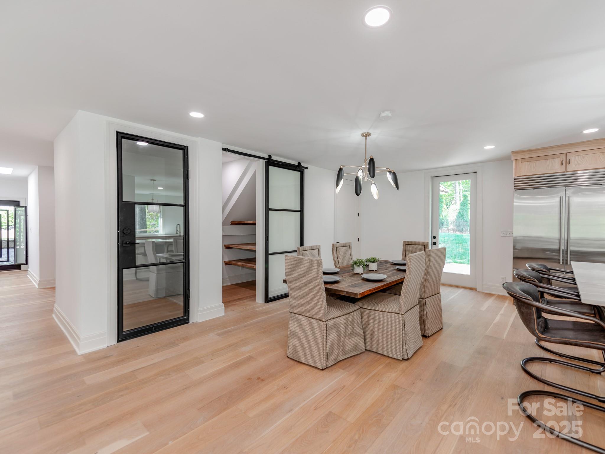 1417 South Wendover Road Charlotte, NC 28211 - Photo 9 of 44 a kitchen with stainless steel appliances granite countertop a sink stove and wooden floor