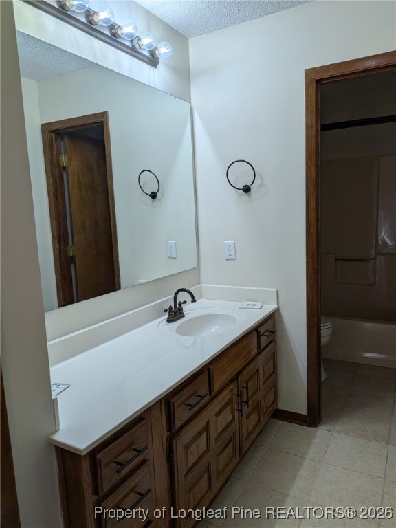 481 Sierra Trail Spring Lake, NC 28390 - Photo 14 of 24 a bathroom with a sink vanity and a mirror
