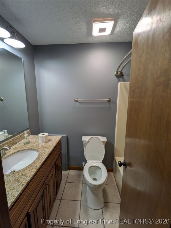 481 Sierra Trail Spring Lake, NC 28390 - Photo 18 of 24 a bathroom with a toilet a sink and mirror