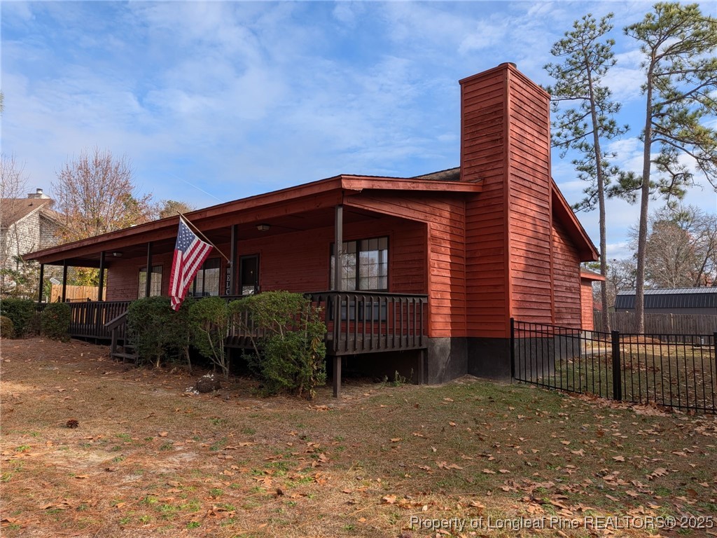 481 Sierra Trail Spring Lake, NC 28390 - Photo 2 of 24 a front view of a house with a garden