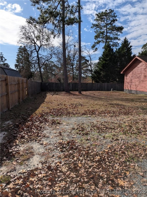 481 Sierra Trail Spring Lake, NC 28390 - Photo 22 of 24 a view of dirt yard with a large tree