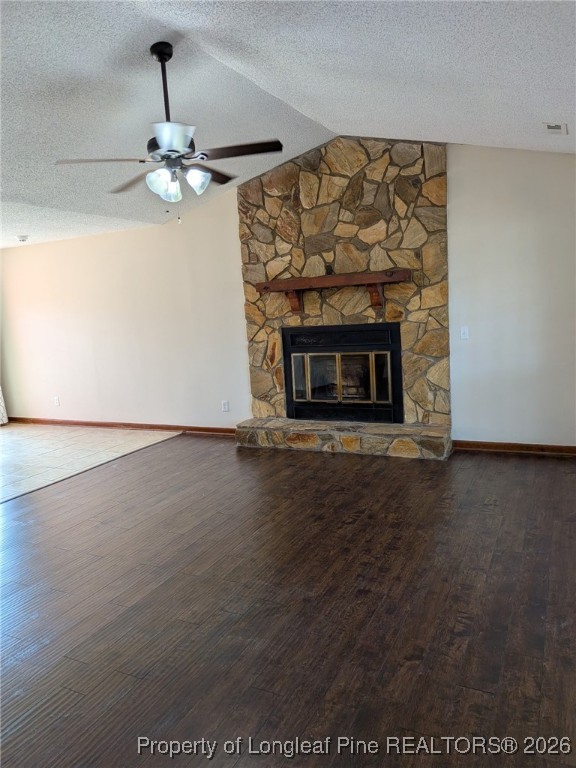 481 Sierra Trail Spring Lake, NC 28390 - Photo 5 of 24 an empty room with wooden floor fireplace and chandelier