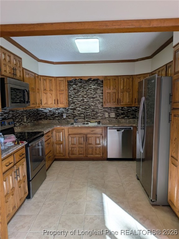 481 Sierra Trail Spring Lake, NC 28390 - Photo 6 of 24 a kitchen with stainless steel appliances granite countertop a stove a sink and a refrigerator